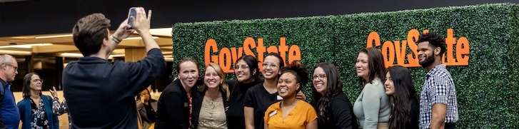 A group of people smiling